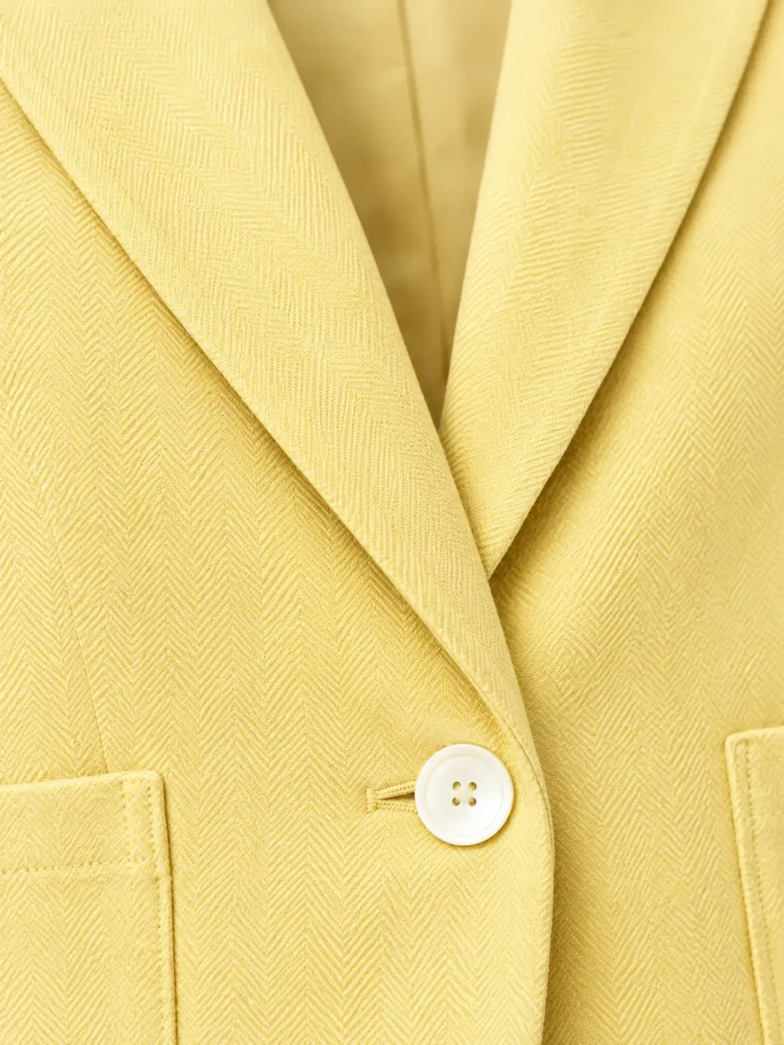 Boardwalk Cropped Blazer, close-up of the notch lapel and single white button