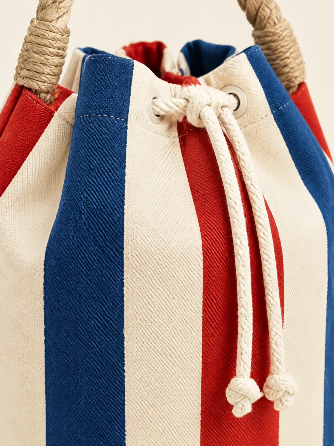 Deck Chair Stripe Bucket, close-up of the wide deck-chair stripes and tan rope handle