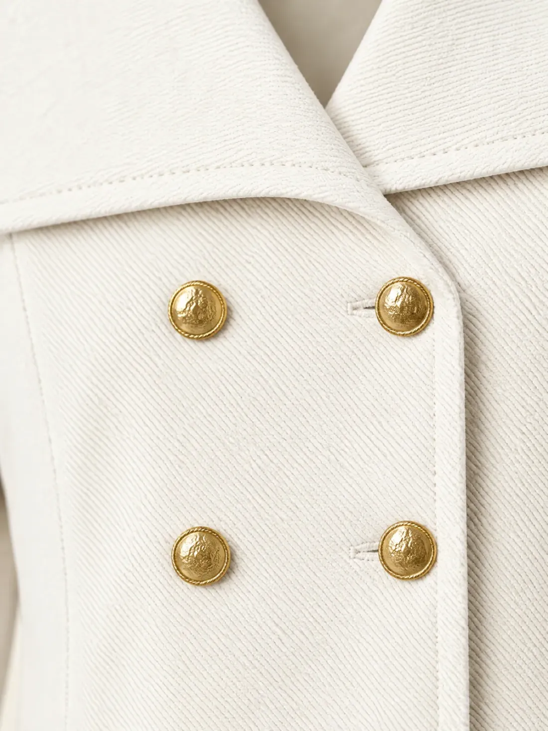 Deck Letter Boxy Jacket, close-up of the double-breasted gold-tone button rows and the collar corner