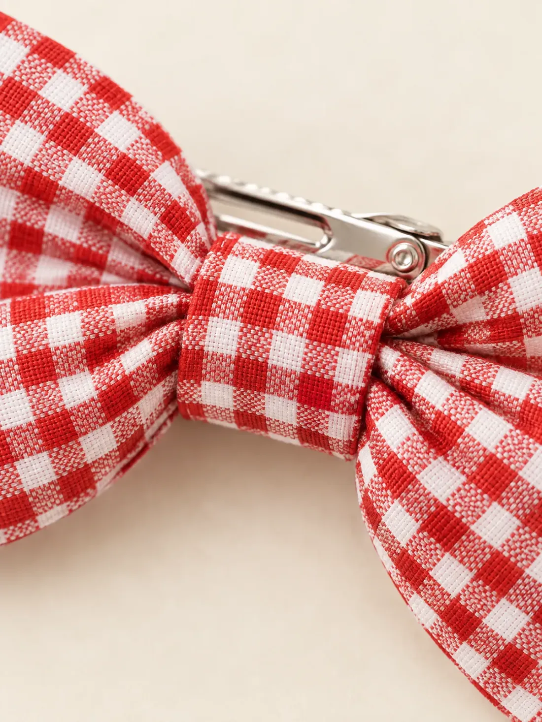 Gingham Bow Clip Set, close-up of the knotted centre of the gingham bow and the metal clip behind it