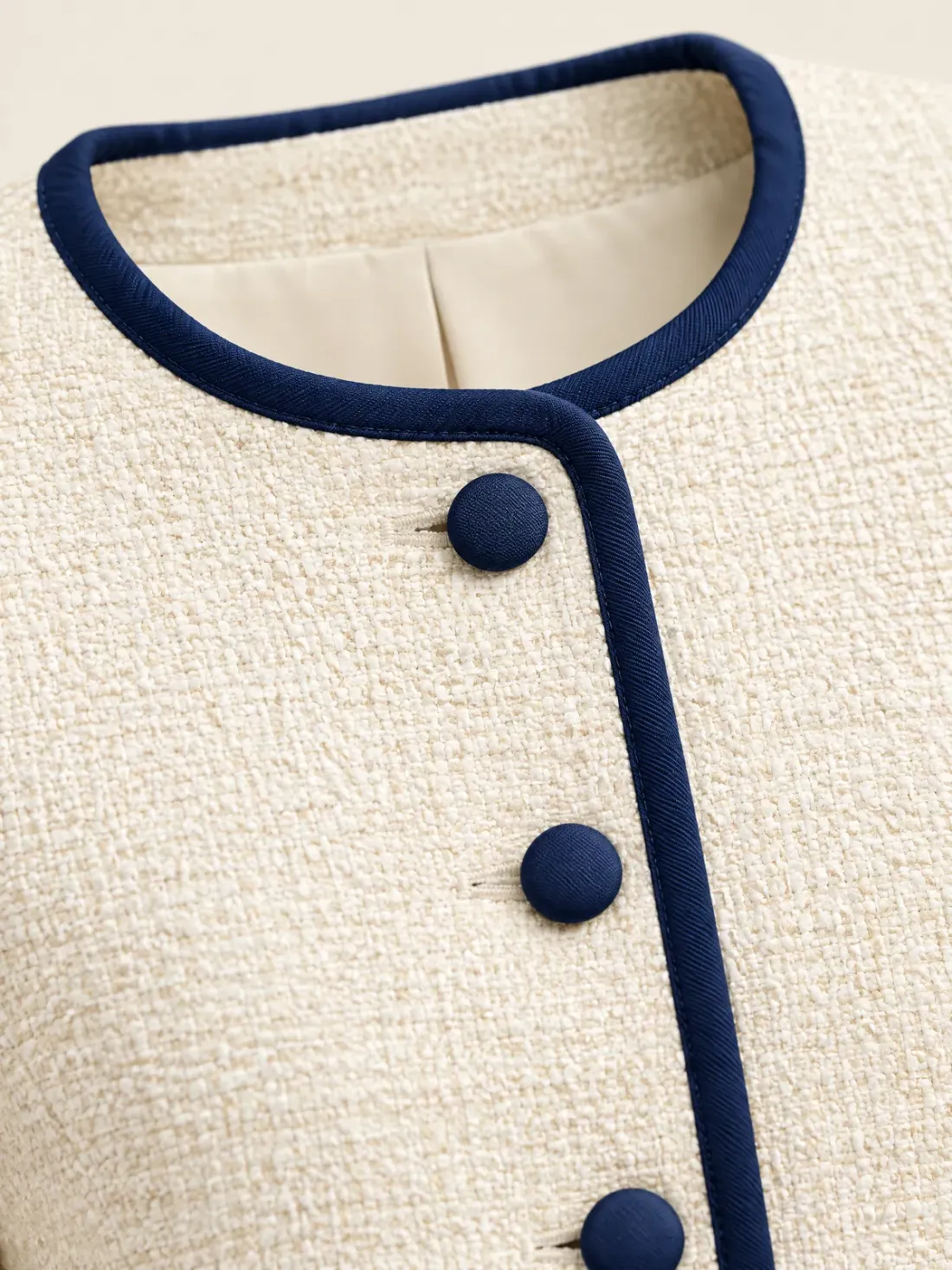 Quay Collarless Button Jacket, close-up of the ink piping along the round neckline and front edge